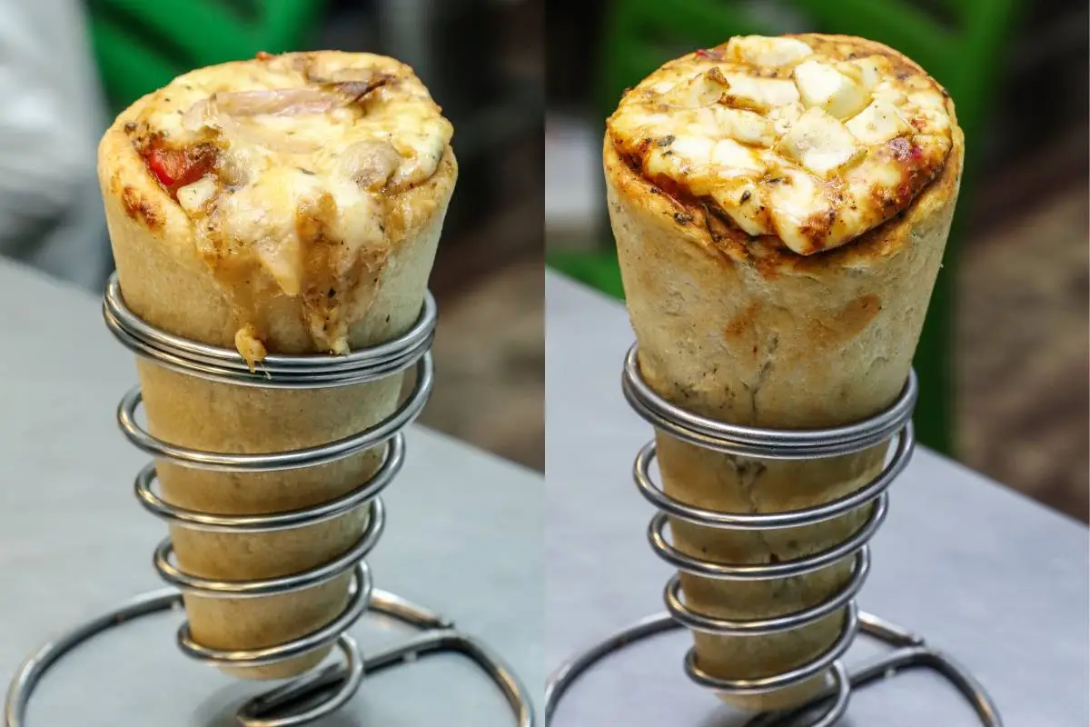 Pizza de cone com recheios variados servida em suporte de metal.
